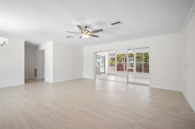 unfurnished room featuring visible vents, a ceiling fan, crown molding, and baseboards