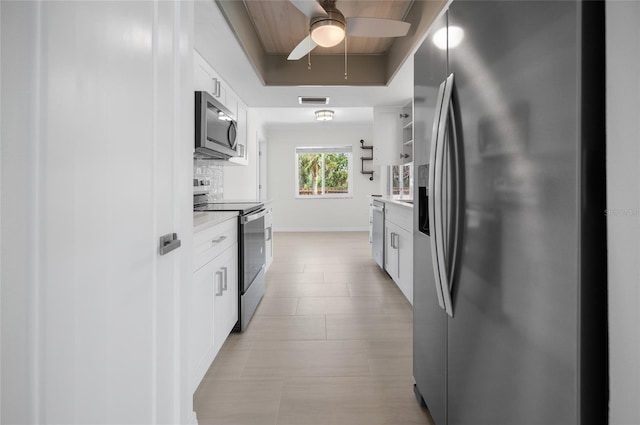 kitchen featuring white cabinetry, visible vents, stainless steel appliances, light countertops, and a ceiling fan