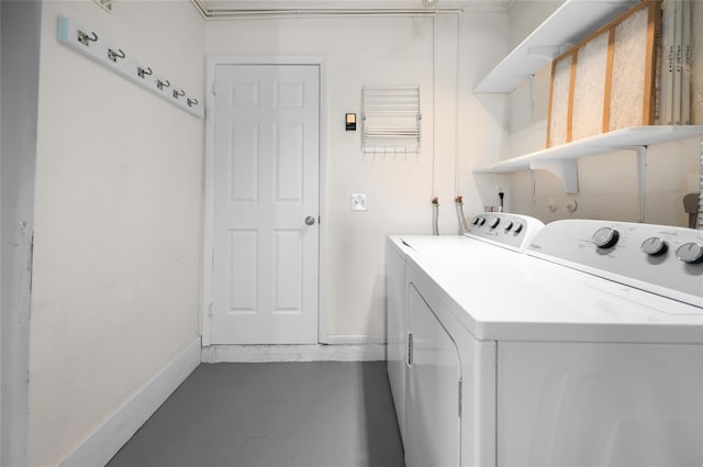 laundry area featuring baseboards, laundry area, and independent washer and dryer