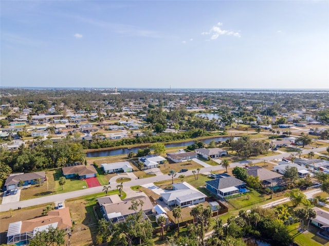 bird's eye view featuring a residential view and a water view