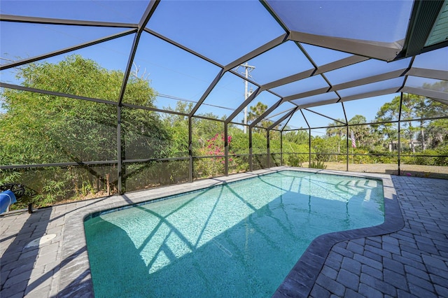 2957 Montgomery Dr, Port Charlotte, FL 33981 - outdoor pool with glass enclosure and a patio area