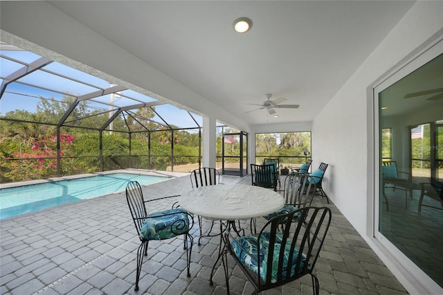 2957 Montgomery Dr, Port Charlotte, FL 33981 - outdoor pool featuring glass enclosure, ceiling fan, and a patio area