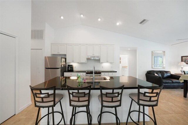 2957 Montgomery Dr, Port Charlotte, FL 33981 - kitchen featuring a sink, dark countertops, freestanding refrigerator, and visible vents