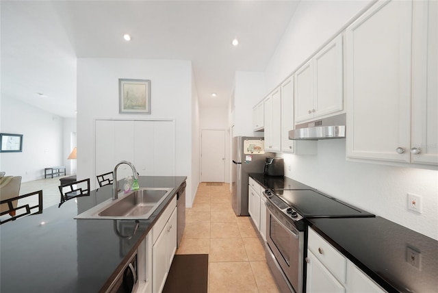 2957 Montgomery Dr, Port Charlotte, FL 33981 - kitchen featuring under cabinet range hood, stainless steel appliances, dark countertops, and a sink