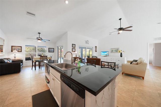 2957 Montgomery Dr, Port Charlotte, FL 33981 - kitchen featuring stainless steel dishwasher, a ceiling fan, open floor plan, and a sink