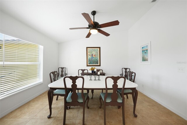 2957 Montgomery Dr, Port Charlotte, FL 33981 - dining area with baseboards, a ceiling fan, light tile patterned floors, and lofted ceiling