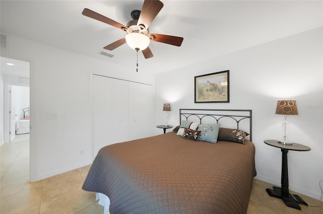 2957 Montgomery Dr, Port Charlotte, FL 33981 - bedroom featuring visible vents, a closet, light tile patterned flooring, baseboards, and a ceiling fan