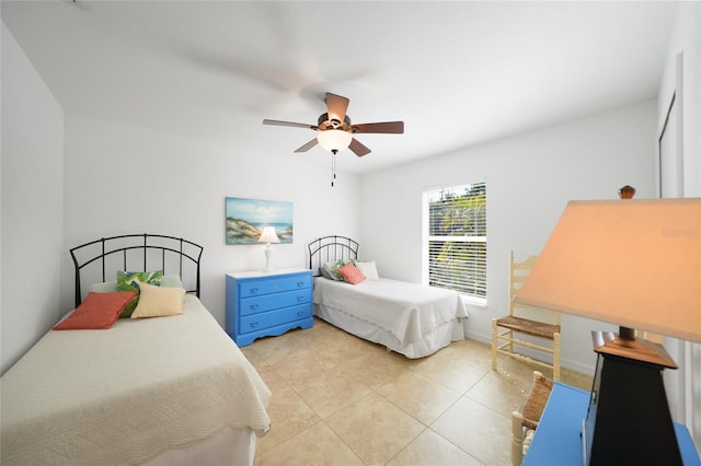 2957 Montgomery Dr, Port Charlotte, FL 33981 - bedroom featuring light tile patterned floors and a ceiling fan
