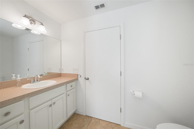 2957 Montgomery Dr, Port Charlotte, FL 33981 - bathroom featuring vanity, tile patterned flooring, toilet, and visible vents