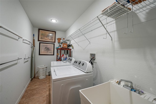2957 Montgomery Dr, Port Charlotte, FL 33981 - washroom with laundry area, tile patterned flooring, washing machine and dryer, a sink, and baseboards