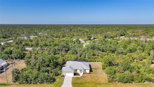 2957 Montgomery Dr, Port Charlotte, FL 33981 - aerial view featuring a view of trees