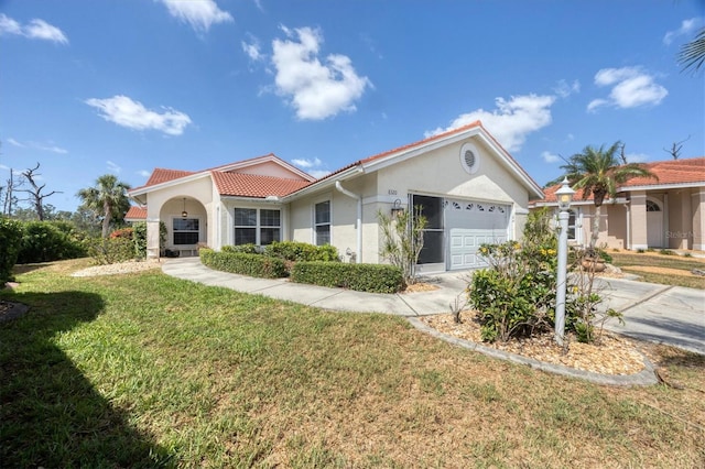 view of front facade with a garage, a front lawn, stucco siding, a tiled roof, and concrete driveway