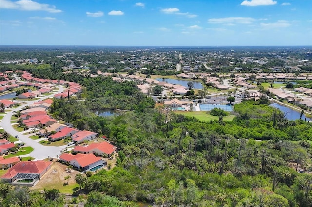 drone / aerial view featuring a water view and a residential view