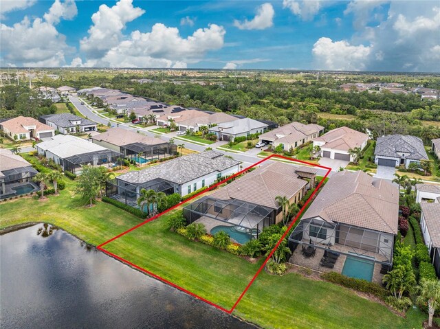 aerial perspective of suburban area featuring property parcel outlined and a large body of water