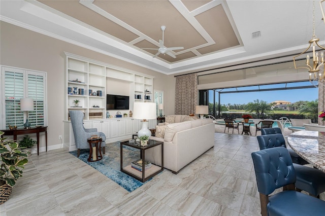 living room with a ceiling fan, crown molding, and a chandelier