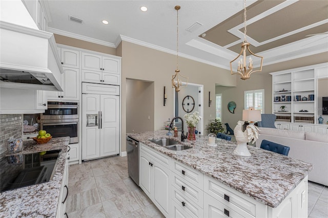 kitchen featuring a chandelier, a sink, crown molding, stainless steel appliances, and white cabinets