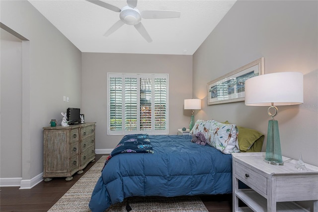 bedroom with baseboards, wood finished floors, and a ceiling fan