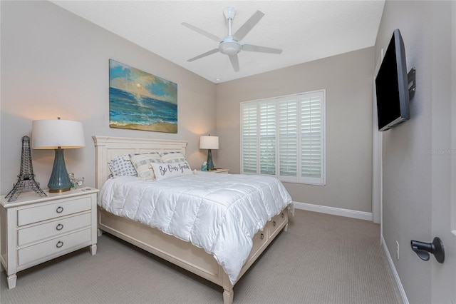 bedroom featuring carpet, baseboards, and a ceiling fan