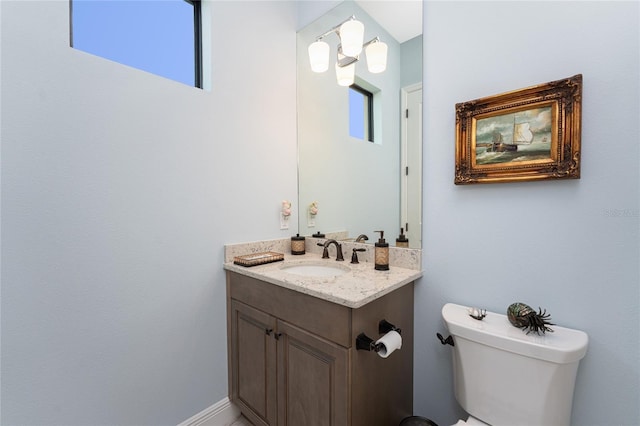 bathroom with toilet and vanity