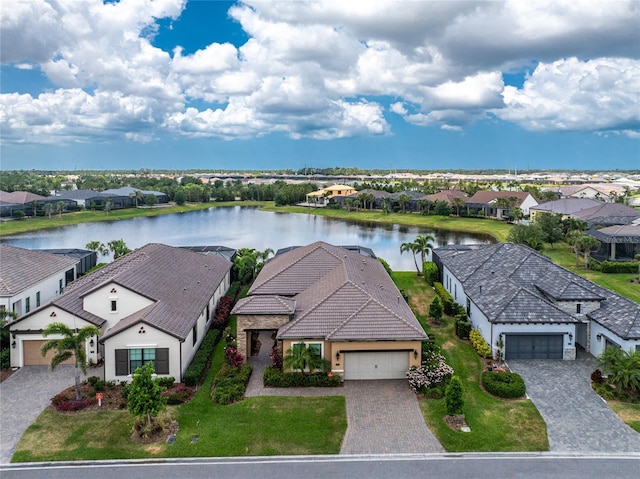 aerial view of residential area featuring a nearby body of water