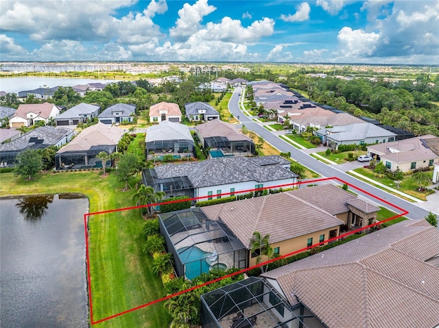 aerial perspective of suburban area featuring a nearby body of water and property parcel outlined
