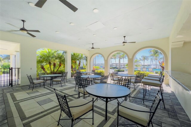 view of patio / terrace featuring ceiling fan and outdoor dining area
