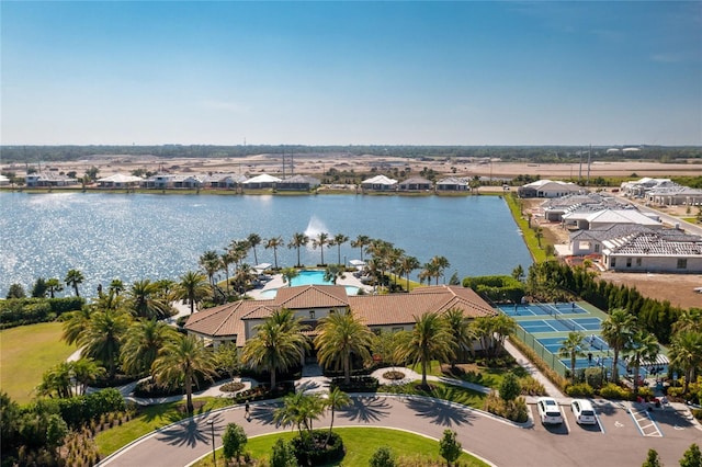 aerial view of residential area featuring a large body of water