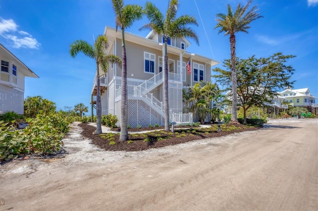 6890 Palm Island Dr, Placida, FL 33946 - view of building exterior featuring stairs