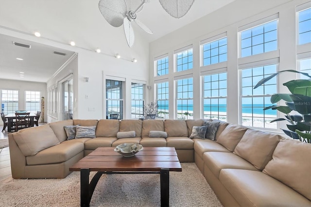 6890 Palm Island Dr, Placida, FL 33946 - living room with visible vents, a ceiling fan, a water view, and carpet floors