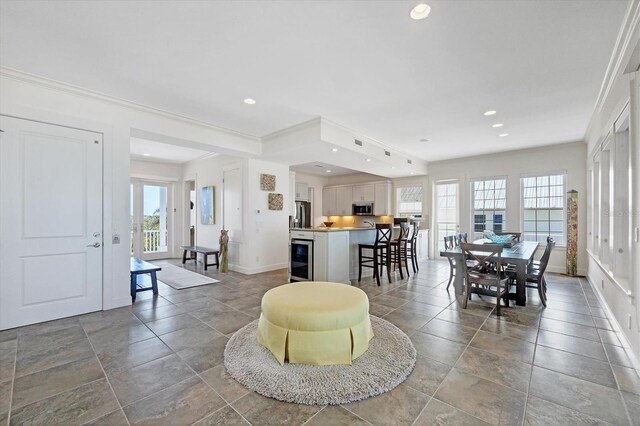 6890 Palm Island Dr, Placida, FL 33946 - living room featuring ornamental molding, recessed lighting, and baseboards