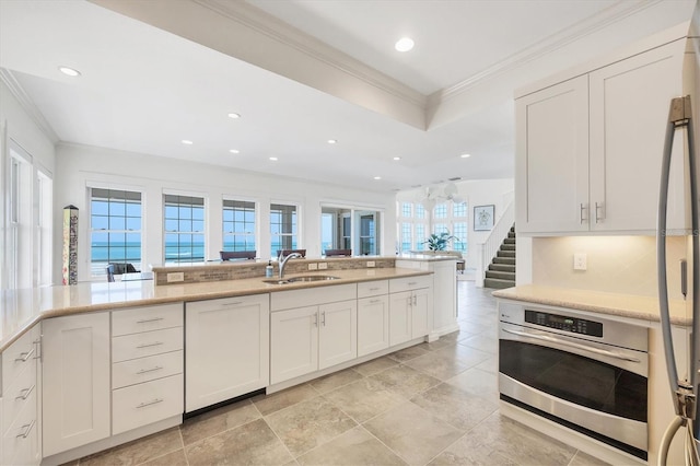 6890 Palm Island Dr, Placida, FL 33946 - kitchen featuring recessed lighting, ornamental molding, appliances with stainless steel finishes, and a sink
