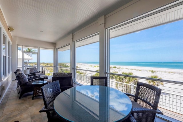 6890 Palm Island Dr, Placida, FL 33946 - sunroom / solarium featuring a beach view and a water view
