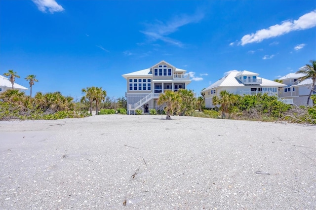6890 Palm Island Dr, Placida, FL 33946 - rear view of house featuring stairs