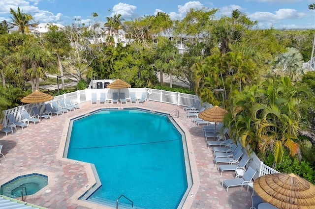 6890 Palm Island Dr, Placida, FL 33946 - community pool featuring fence, a community hot tub, and a patio