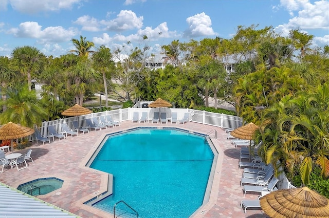 6890 Palm Island Dr, Placida, FL 33946 - community pool featuring fence, a community hot tub, and a patio area