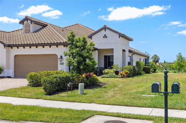 11125 Mcdermott Ct, Englewood, FL 34223 - mediterranean / spanish house with a front lawn and stucco siding