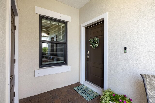 11125 Mcdermott Ct, Englewood, FL 34223 - entrance to property featuring stucco siding