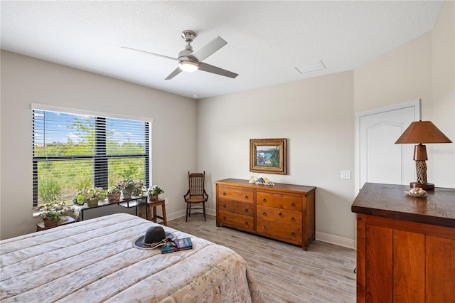 11125 Mcdermott Ct, Englewood, FL 34223 - bedroom featuring baseboards, ceiling fan, and light wood-type flooring