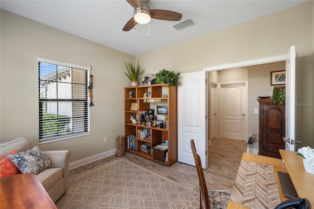 11125 Mcdermott Ct, Englewood, FL 34223 - home office featuring a ceiling fan, visible vents, wood finished floors, baseboards, and a wealth of natural light