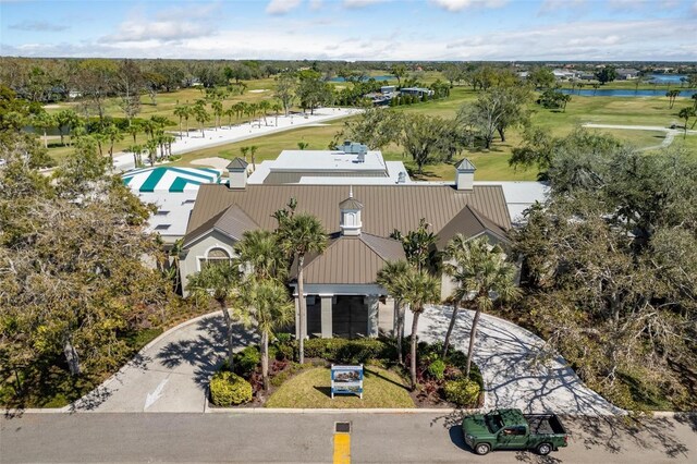 11125 Mcdermott Ct, Englewood, FL 34223 - drone / aerial view with view of golf course and a water view