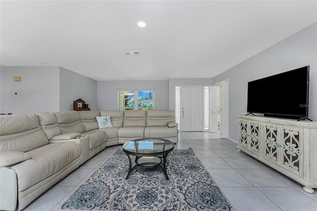 living area with visible vents, recessed lighting, and light tile patterned floors