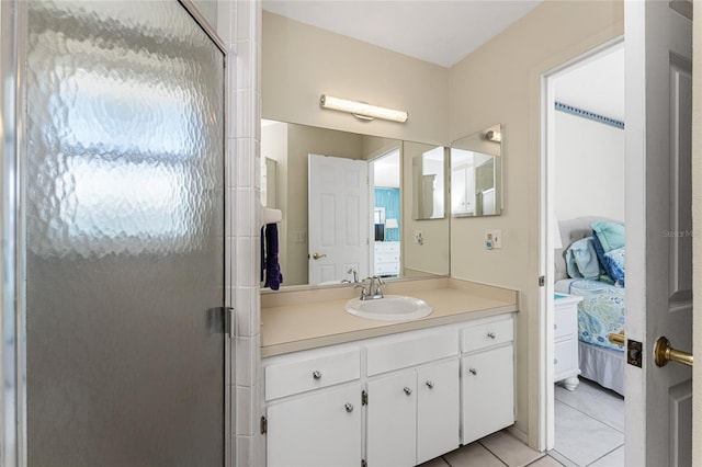 bathroom featuring vanity, tile patterned floors, ensuite bathroom, and a stall shower