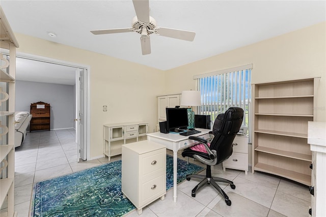 office featuring a ceiling fan and light tile patterned flooring