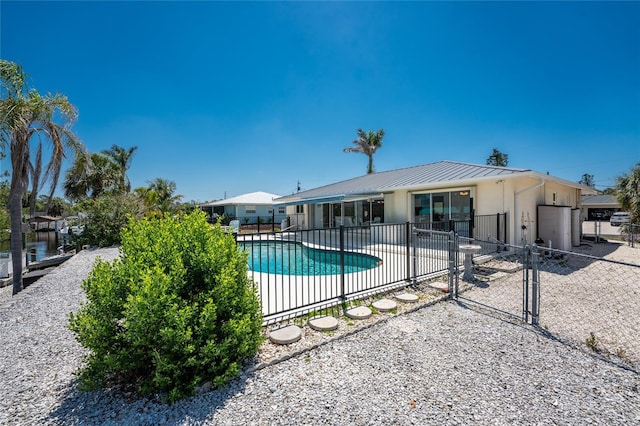 view of pool featuring fence, a gate, a fenced in pool, and a patio