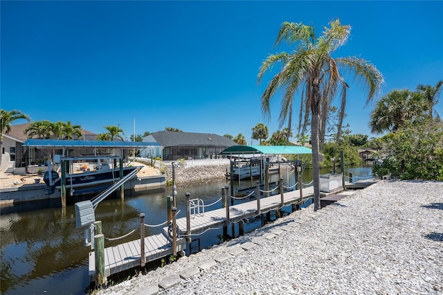 dock area with boat lift and a water view