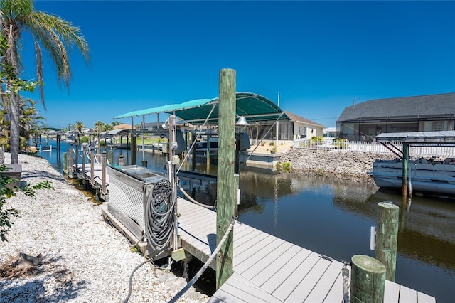 dock area featuring a water view and boat lift