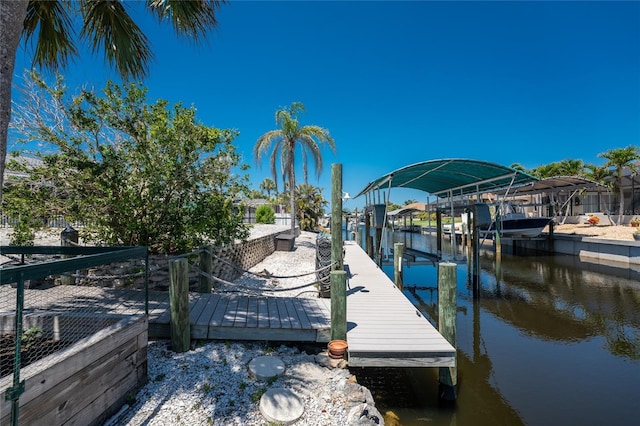 view of dock featuring boat lift and a water view