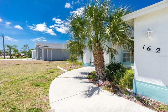 162 Fairway Rd, Rotonda West, FL 33947 - exterior space featuring a lawn
