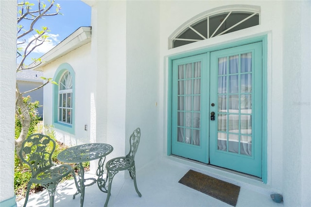162 Fairway Rd, Rotonda West, FL 33947 - property entrance featuring french doors and stucco siding