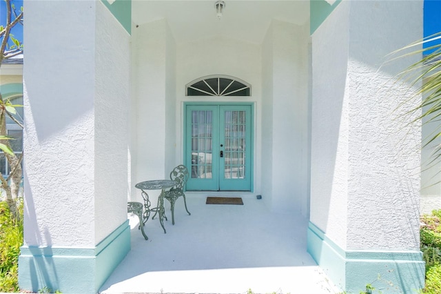 162 Fairway Rd, Rotonda West, FL 33947 - entrance to property featuring stucco siding and french doors